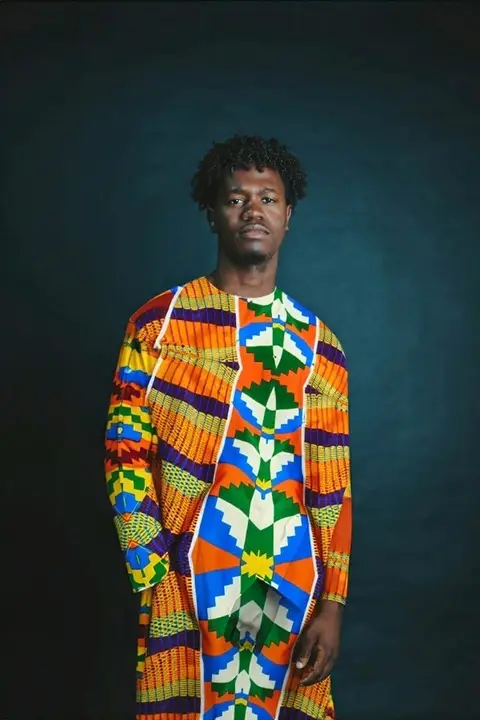 A guest in a kente kaftan