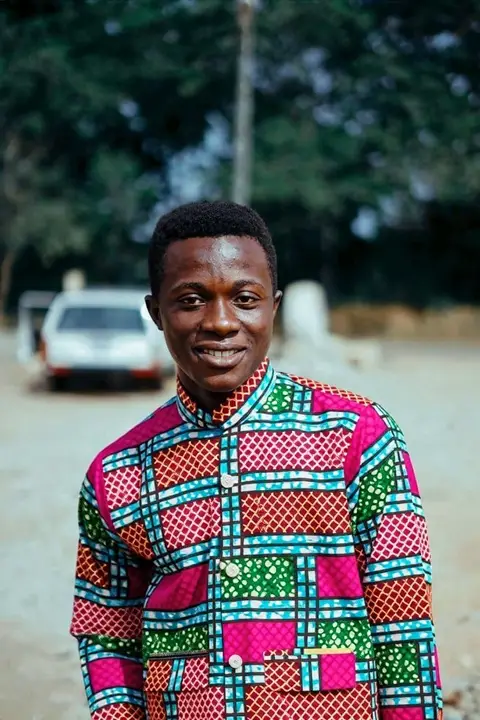 A guest in an ankara shirt, from a selfie